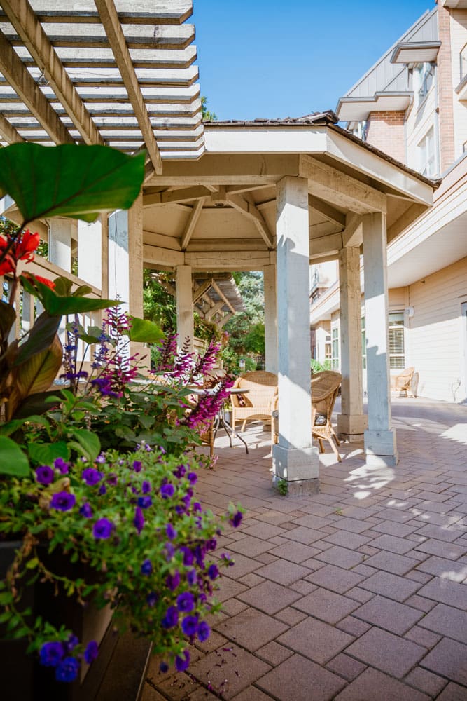 outdoor gazebo with chairs and flowers