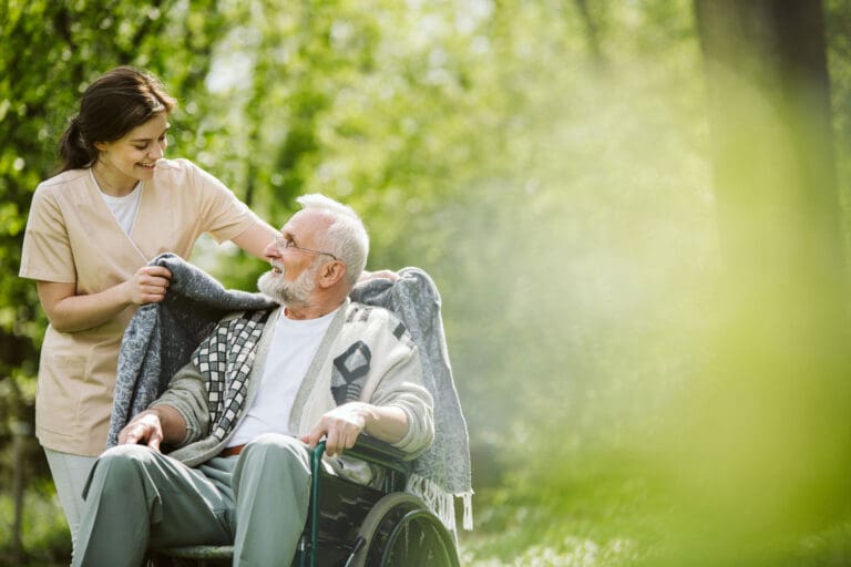 volunteer helping senior man